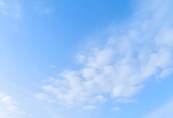 Obraz premium Clear blue sky with fluffy white clouds drifting slowly
