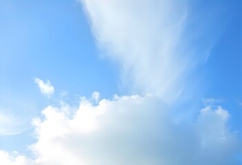 Obraz premium Clear blue sky with fluffy white clouds drifting slowly