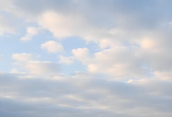 Obraz premium Clear blue sky with fluffy white clouds drifting slowly