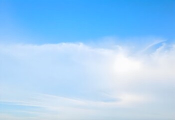 Obraz premium Clear blue sky with fluffy white clouds drifting slowly