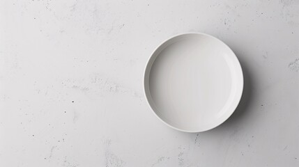 10. A flatlay mockup of a ceramic plate, emphasizing its smooth surface and classic design, set against a minimal backdrop.