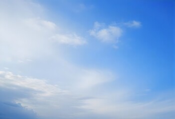 Obraz premium Fluffy Clouds Against a Blue Sky