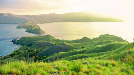 Beautiful seaside view of bay and island with sunrise at Gili Lawa, Komodo National Park, Indonesia. © Balnyes Visuals