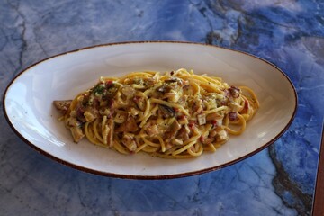 Spaghetti Cabonara on a plate close up view.