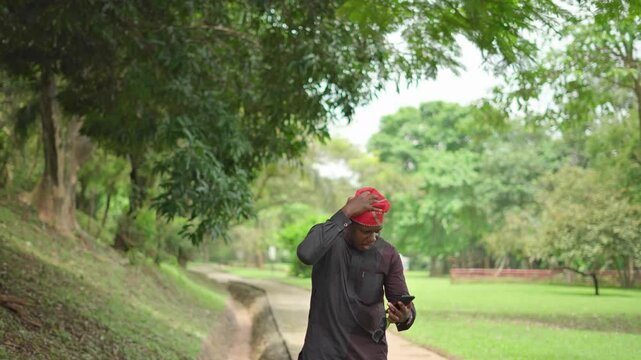 Shock, sadness as Nigerian Yoruba man sees sad news on his phone.
 