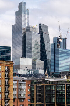 Skyline view of contemporary skyscrapers with construction cranes in the background, representing the ongoing growth and dynamic development of urban landscapes in London