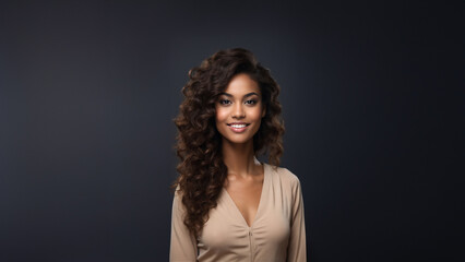 A beautiful brunette model with a healthy complexion and a warm smile is pictured against a clean studio background. Her professional appearance and natural beauty