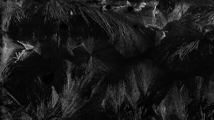 Frosted glass texture from freezing, displaying delicate ice flowers patterns and translucent cold...