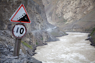 Traffic sign along the road next to the border with Afghanistan in the Gorno-Badakhshan region in...