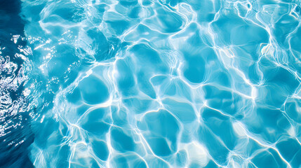 Obraz premium Top view on clear blue pool water surface with ripples and light reflections