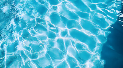 Fototapeta premium Top view on clear blue pool water surface with ripples and light reflections