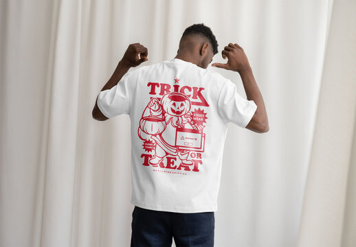 Mockup Of Man Wearing Customized T-Shirt In Studio, Rear View