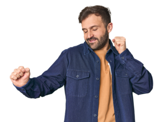 Studio portrait of young Hispanic male dancing and having fun.