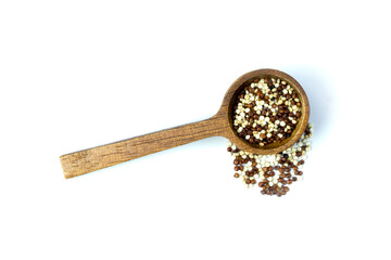 Dry black and white quinoa (Chenopodium quinoa)  seeds in wooden spoon and outside isolated on white background top view, flat lay. Healthy food concept. Copy space.