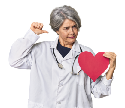 Caucasian mid-age doctor with heart symbol feels proud and self confident, example to follow.