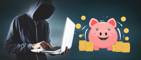 hacker with computer and piggy bank