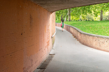 Obraz premium Woman walking along pedestrian walkway. Pamplona, ​​Navarra