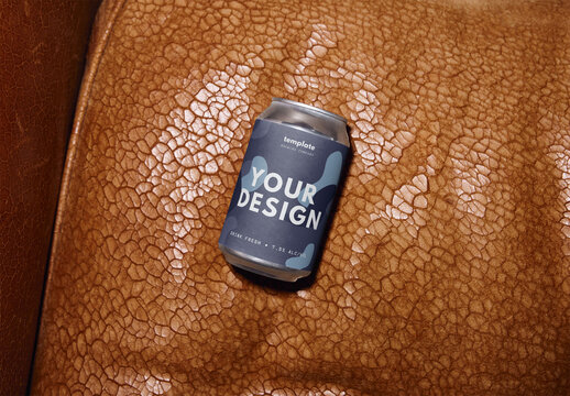 Mockup Of Customizable 12 Oz Beer Can On Leather Seat