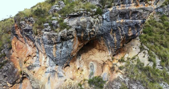 Beautiful drone shot of cave formations in a rock mountain in Millpu, Ayacucho in Peru.