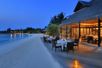Fototapeta premium Soft waves roll gently onto the sandy shore, where an exquisite dining setup awaits. Lanterns light the path as couples savor a romantic dinner surrounded by lush palm trees and tranquil waters.