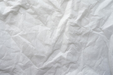 Full frame shot of crumpled tissue fabric texture and background. Tissue fabric is slightly rough and crisp in texture.
