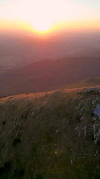 Rtanj mountain. Aerial view of the first rays of the rising sun above highest mountain peak Siljak.