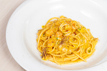 Seafood carbonara spaghetti. A classic Italian dish, seafood carbonara is made with egg, shrimp, clams, and cuttlefish.