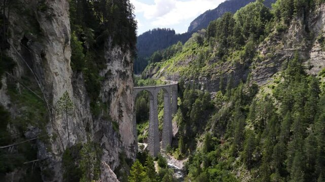 Dramatic aerial drone over the famous Landwasser Viaduct Flyover in Canton Graubunden in the Alps.