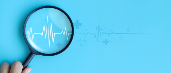 World heart day. focus heartbeat on blue background for checking the function of the patient heart....