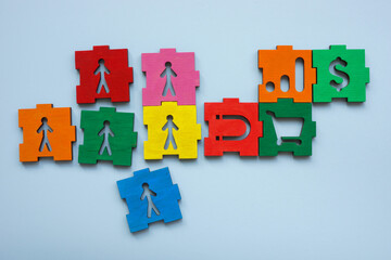 Puzzle with clients, magnet, and sales as a symbol of customer attraction or sales strategy.