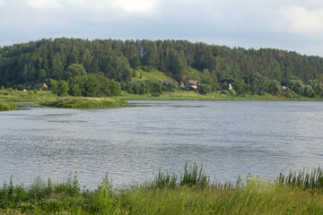 Beautiful river landscape on a summer day. The bend of the Nemunas (Neman) River near the town of Merkinė, southern Lithuania.