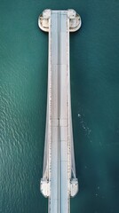 Aerial View of a Bridge Over Teal Water