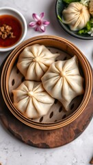 Delicious traditional Chinese dim sum in a bamboo steamer with garnish