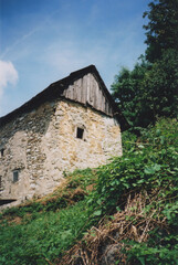Abandoned Mountain Hut in Clabuzzaro Village during a Sunny Summer Day. Drenchia, Udine Province, Friuli Venezia Giulia, Italy. Film Photography