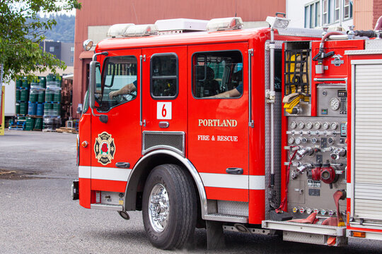 Portland, Oregon/USA-June 19, 2019: Firetruck with  first responders and rescuers hurrying to an accident place, responding on emergency call. High quality picture for download.
