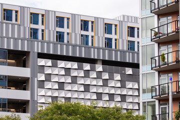 Modern architecture building exterior design with nice patterns, windows, close up details. High quality picture for download