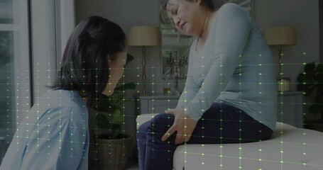 Animation of medical data processing over diverse female physiotherapist and patient - Powered by Adobe