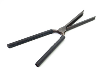 Ancient barber pair of tongs on white background. Vintage curling iron. beauty concept