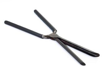Ancient barber pair of tongs on white background. Vintage curling iron. beauty concept