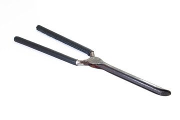 Ancient barber pair of tongs on white background. Vintage curling iron. beauty concept