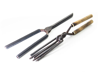 Ancient barber pair of tongs on white background. Vintage curling iron. beauty concept