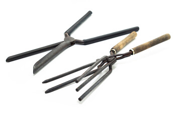 Ancient barber pair of tongs on white background. Vintage curling iron. beauty concept