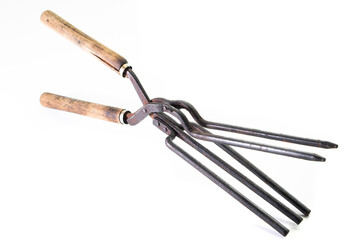 Ancient barber pair of tongs on white background. Vintage curling iron. beauty concept