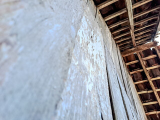 features a rustic wooden ceiling with exposed beams and aged planks