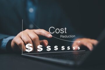 Cost reduction concept. Businessman working on company cost saving. Cost wording on decrease money with down arrow. Cost Management, Economy recession, low budget, Effective business, Expense reduce,