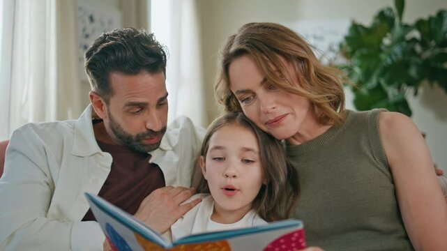 Bonding family reading fairytaile book spending free time at cozy house closeup