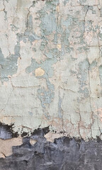 Peeling paint on an old wall. Grunge background for design.Selective focus