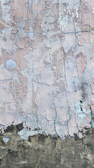 Peeling paint on an old wall. Grunge background for design.Selective focus