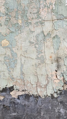 Peeling paint on an old wall. Grunge background for design.Selective focus