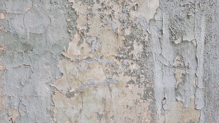 Peeling paint on an old wall. Grunge background for design.Selective focus